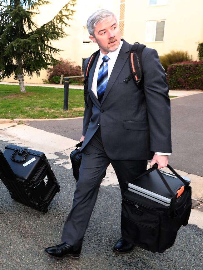 AFP officers leaving Ms Smethurst’s home.