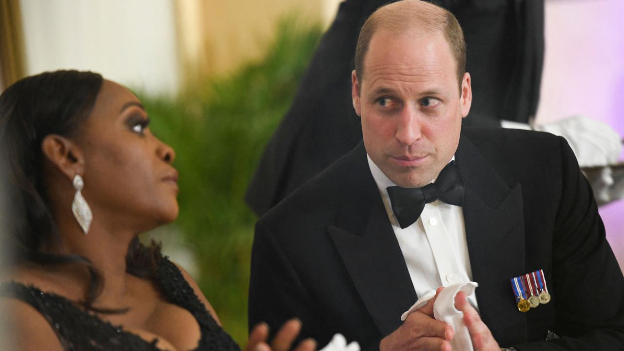 Wife of Jamaican Prime Minister Juliet Holness speaks to Prince William during a state dinner at Kings House in Kingston, Jamaica. Picture: Ricardo Makyn/AFP