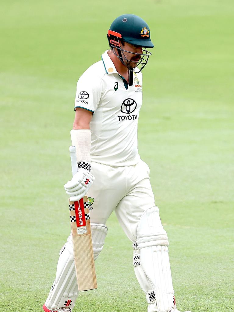 Travis Head trudges off the Gabba after his second golden duck of the match. Picture: Pat Hoelscher / AFP.