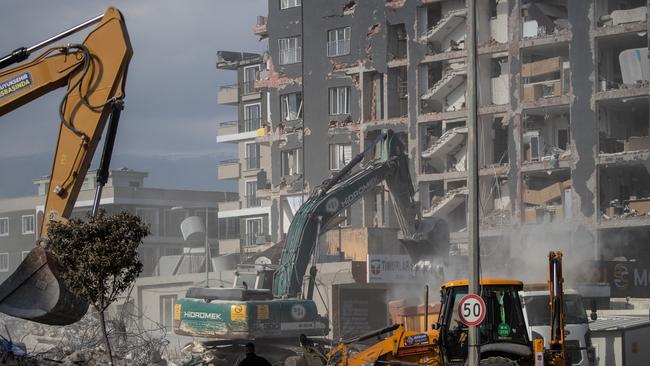 Collapsed buildings are demolished in southeastern Hatay, Turkey, on Sunday. Picture: AFP