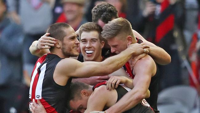 Zach Merrett, David Zaharakis celebrate winning. (Photo by Scott Barbour/Getty Images)