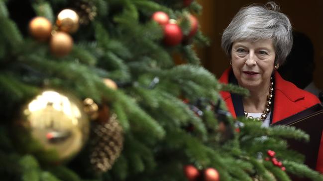 Theresa May leaves Downing Street to address parliament. Picture: AP.