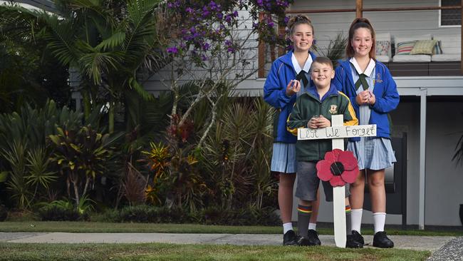 Kimberly, 14, Cooper, 8 and Taylor Day,12, commemorate in their Bundamba driveway for Anzac Day. Picture: Cordell Richardson