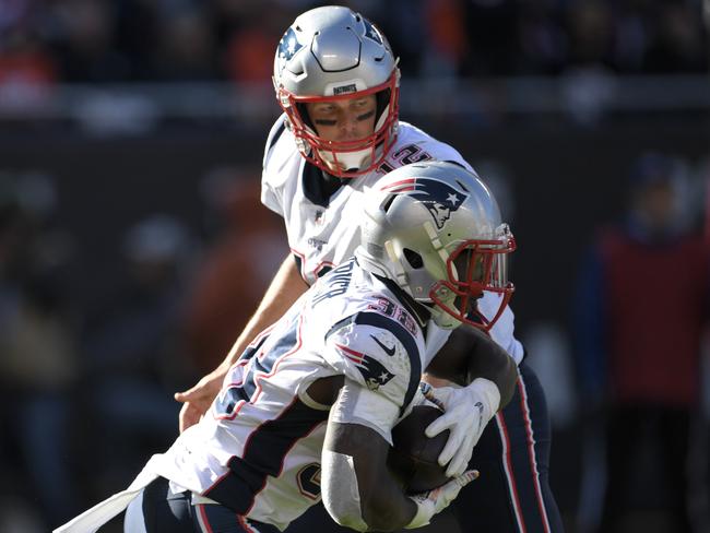 Quarterback Tom Brady #12 of the New England Patriots hands the football to James White #28. Picture: Getty Images