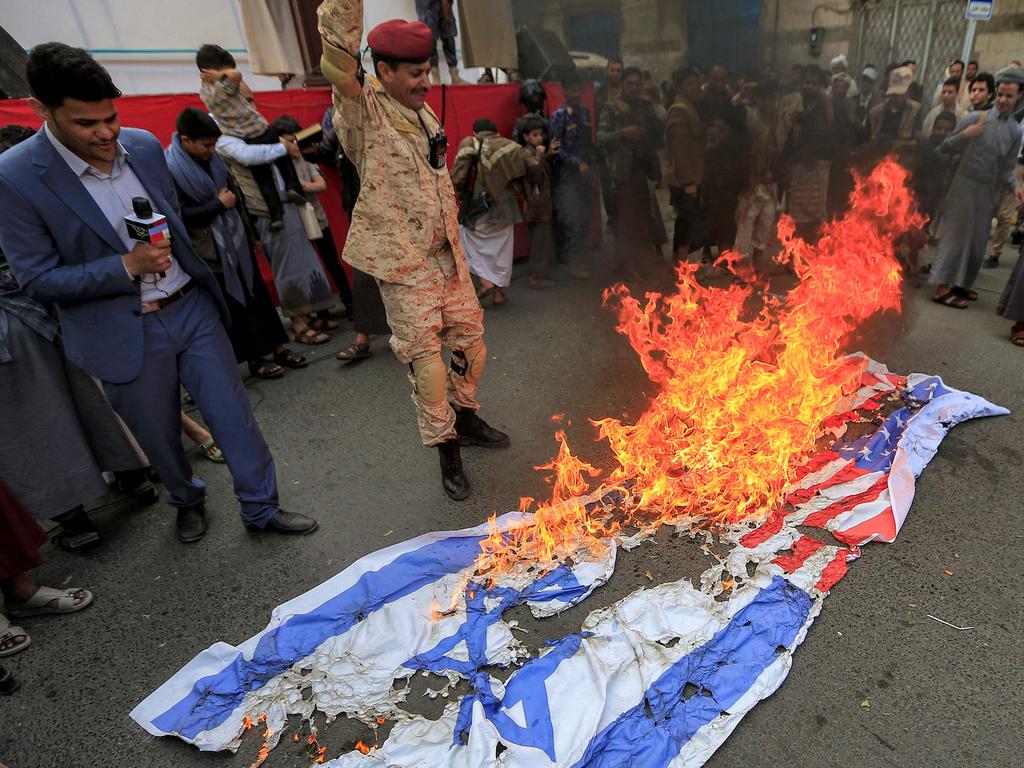 Yemenis set ablaze Israeli and US flags. Picture: Mohammed Huwais/AFP
