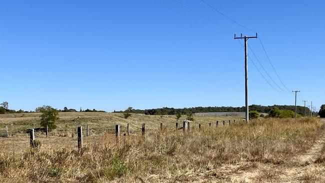 The subject site, which is currently grass fields.