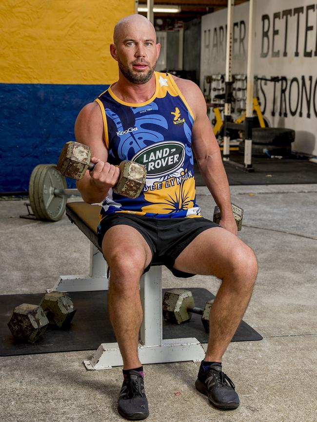 Gold Coast Eagles rugby club have found a loophole in COVID-19 restrictions to get a leg up on competition. They've taken their club gym outside and set up a roster to keep them fit + monitor mental health. Aaron Grant in the outside gym. Picture: Jerad Williams