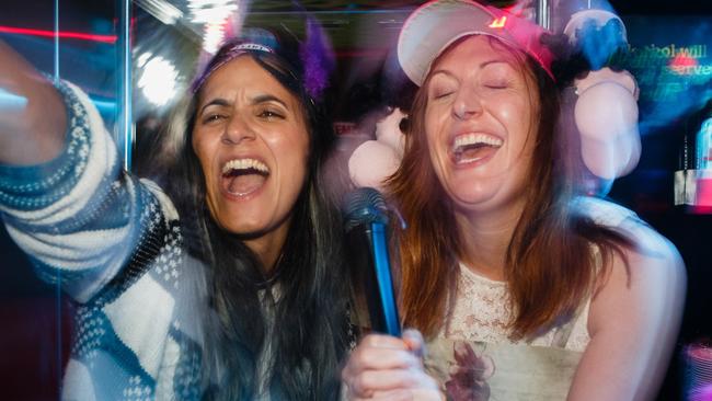 L-R: Madeleine Sami (as Mel) and Celia Pacquola (as Anna) on a karaoke party bus in a scene from NZ film The Breaker UpperersPicture: Madman