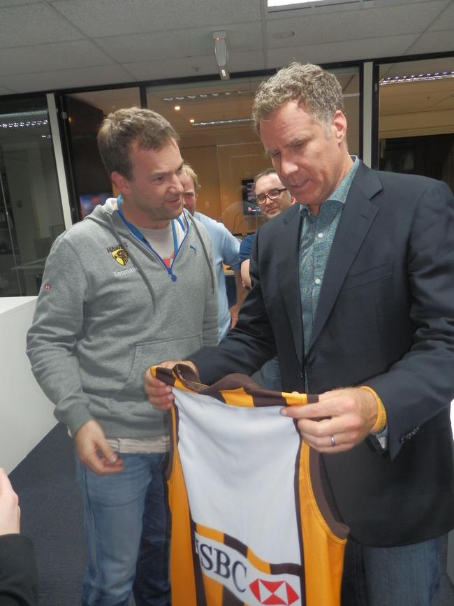 Lehmo giving Hollywood actor Will Ferrell a Hawks jumper.