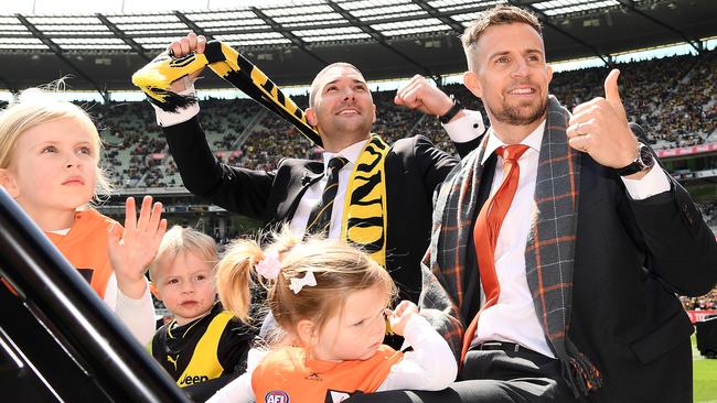 Brett Deledio and Shaun Grigg in the Grand Final retired players motorcade. Picture: Getty Images