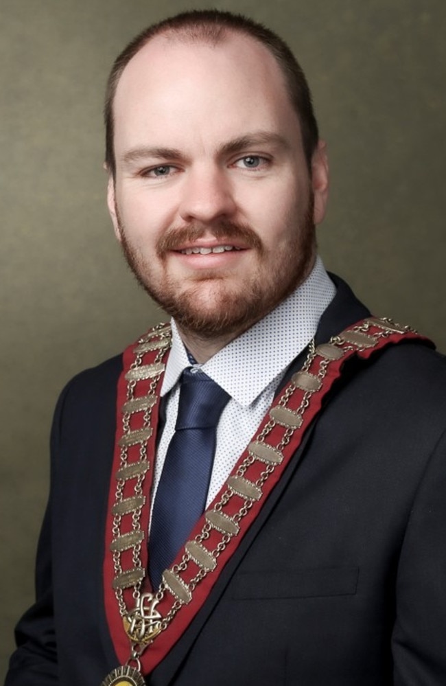 Patrick Conolly, the mayor of Hawkesbury Council, has been taken to hospital after being stabbed when up to six men broke into his home.