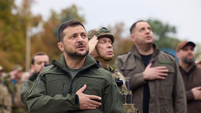 Ukrainian president Volodymyr Zelensky taking part in the flag raising in the de-occupied city of Izyum in 2022. Picture: AFP