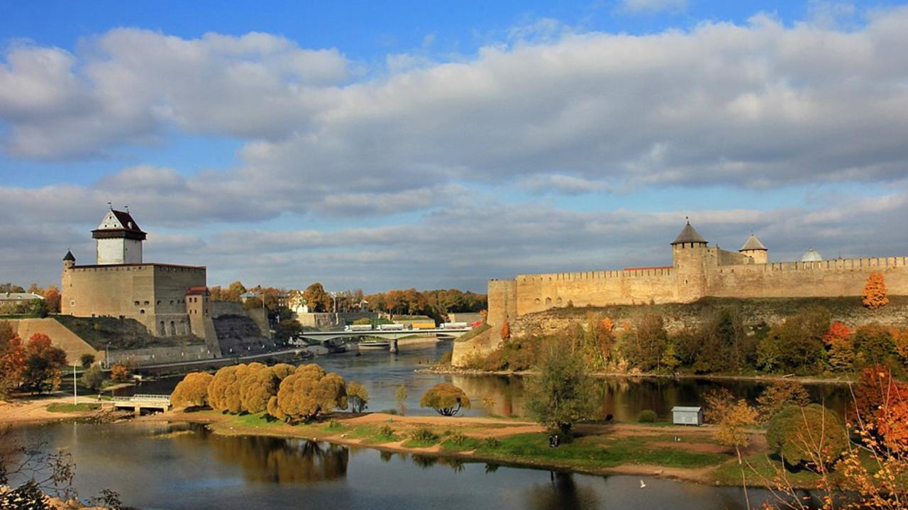 Narva (left) is a literal stone’s throw from Russia – and its Ivangorod Fortress (right). Picture: Wikimedia Commons/Aleksander Kaasik