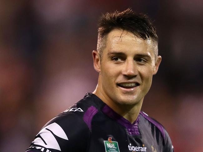WOLLONGONG, AUSTRALIA - APRIL 30: Cooper Cronk of the Storm smiles as he watches on during the round nine NRL match between the St George Illawarra Dragons and the Melbourne Storm at WIN Stadium on April 30, 2017 in Wollongong, Australia.  (Photo by Mark Kolbe/Getty Images)
