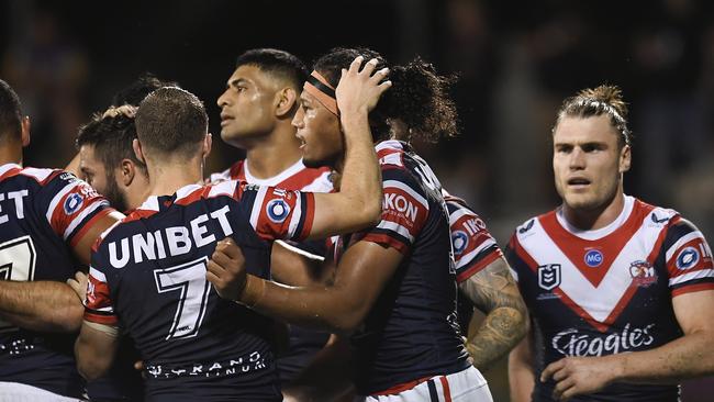 MACKAY, AUSTRALIA – JULY 29: Sitili Tupouniua of the Roosters celebrates with teammates after scoring a try during the round 20 NRL match between the Sydney Roosters and the Parramatta Eels at BB Print Stadium in Mackay, Australia. (Photo by Albert Perez/Getty Images)