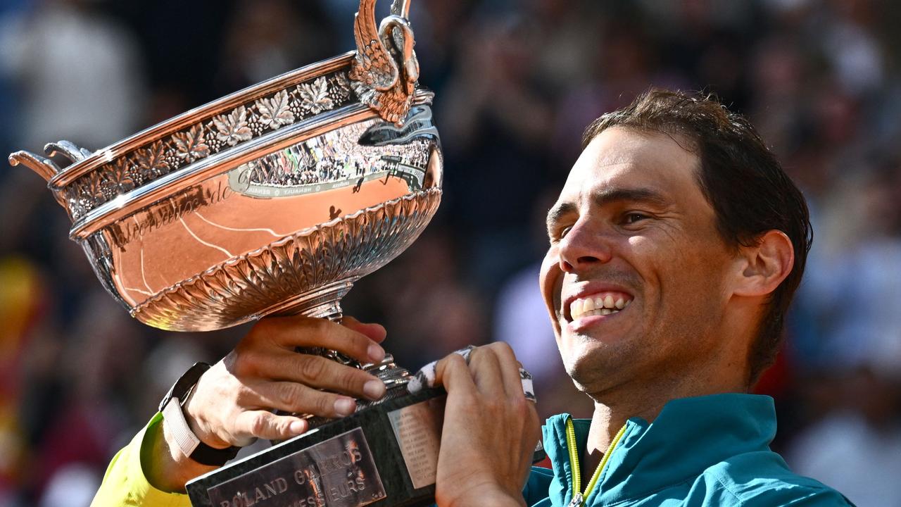 Rafael Nadal poses with The Musketeers' Cup as he celebrates after victory over Norway's Casper Ruud.