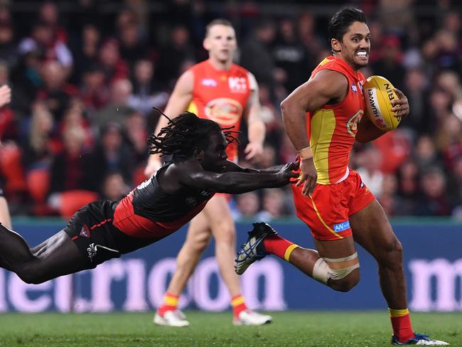 Aaron Hall evades Bomber Anthony McDonald-Tipungwuti in his time at the Suns.