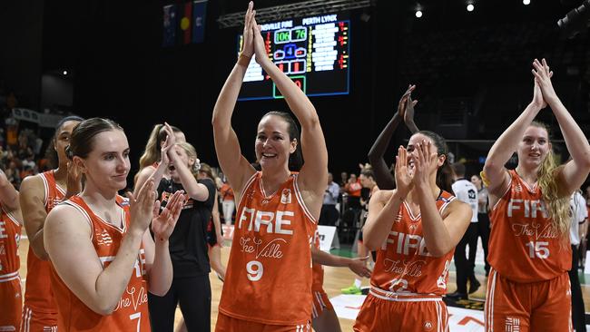 TOWNSVILLE, AUSTRALIA - FEBRUARY 26: The Fire celebrate after winning game two of the WNBL Semi Final series between Townsville Fire and Perth Lynx at Townsville Entertainment Centre, on February 26, 2025, in Townsville, Australia. (Photo by Ian Hitchcock/Getty Images)