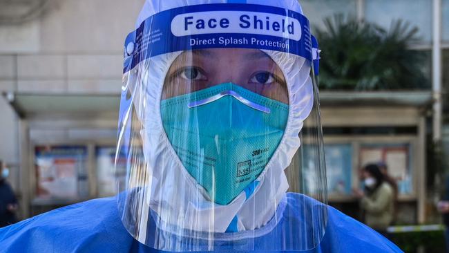 A health worker in Shanghai where a new subtype of Omicron has been identified. Picture: Hector Retamal / AFP