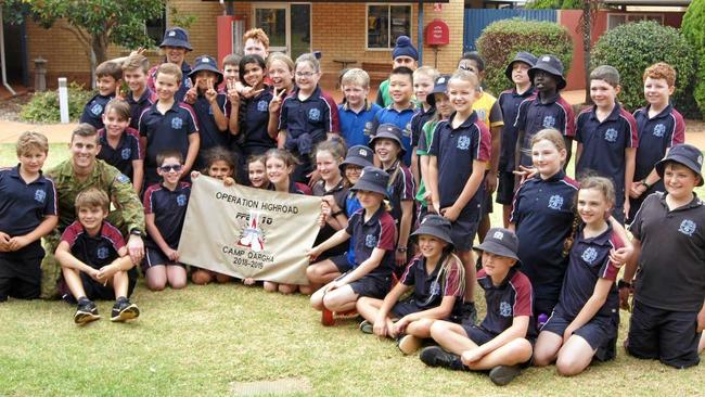 Lieutenant Michael Anderson with his son William and his classmates at Highlands Christian College. Picture: Contributed