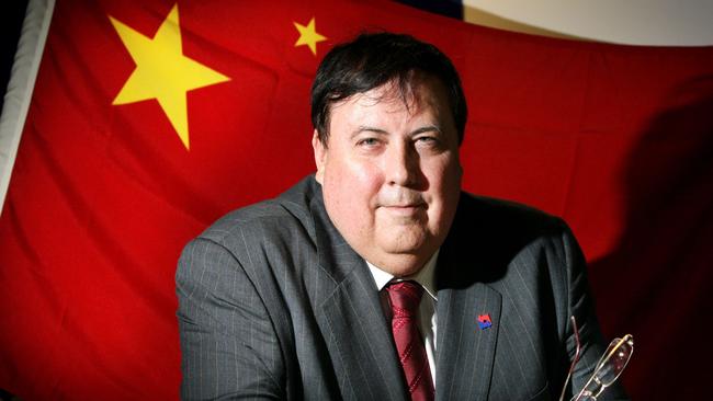 Clive Palmer had a Chinese flag in his Brisbane office when he announced  that $750 million Chinese funding will be going towards the Alpha coal mining project in central Queensland.