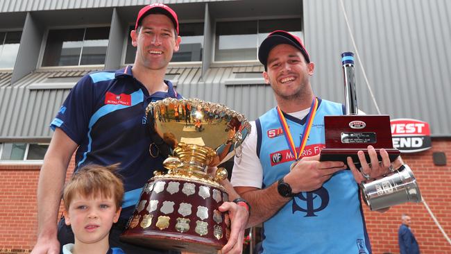 Sturt's coach Marty Mattner and son Oscar with Sturt captain Zane Kirkwood after going back to back last year. Picture: Tait Schmaal.