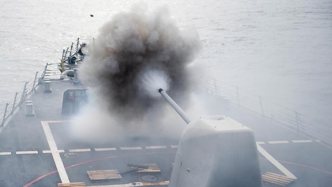 This US Navy photo obtained July 27, 2016 shows the Arleigh Burke-class guided-missile destroyer USS Stethem (DDG 63)as it conducts a firing exercise of the MK 45/5-inch lightweight gun at a surface target during Cooperation Afloat Readiness and Training (CARAT) Singapore on July 26, 2016 in the South China Sea.  CARAT is a series of annual maritime exercises between the US Navy, US Marine Corps and the armed forces of nine partner nations to include Bangladesh, Brunei, Cambodia, Indonesia, Malaysia, the Philippines, Singapore, Thailand, and Timor-Leste.  / AFP PHOTO / Navy Media Content Operations (N / MC1 John PEARL / RESTRICTED TO EDITORIAL USE - MANDATORY CREDIT "AFP PHOTO / US NAVY/MC1 JOHN PEARL" - NO MARKETING NO ADVERTISING CAMPAIGNS - DISTRIBUTED AS A SERVICE TO CLIENTS