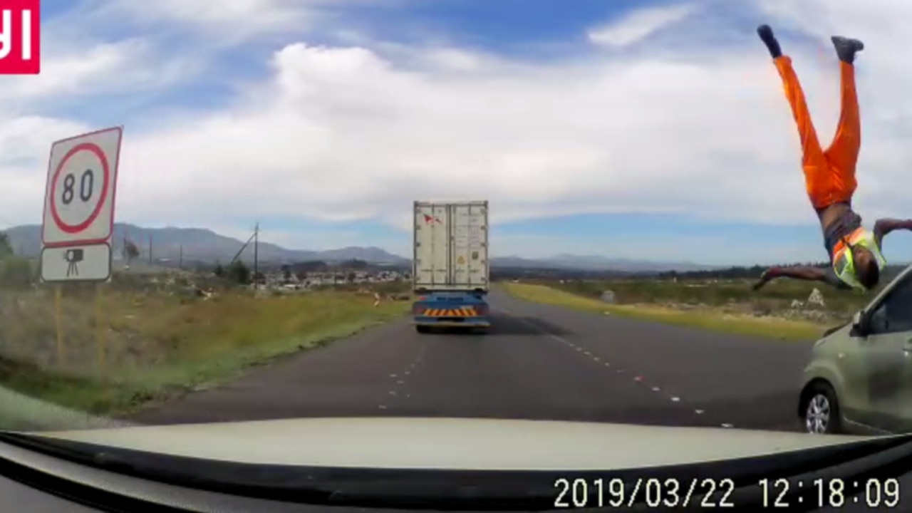 A road worker is sent cartwheeling into the air in a shock video.