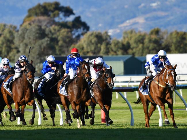 Jockey John Allen rides Trekking to victory in the Group 1 Goodwood, at Morphettville Racecourse in Adelaide. Picture: AAP Image/David Mariuz