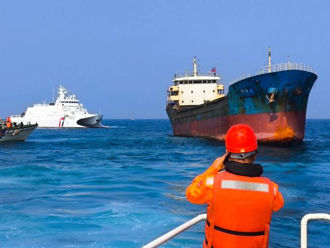 This handout photo taken and released on February 25, 2025 by the Taiwan Coast Guard shows the detained Togolese-registered ship "Hongtai" in Penghu. Taiwan detained a Chinese-crewed cargo ship on February 25 after a subsea telecoms cable was severed off the island, the coast guard said. (Photo by Handout / TAIWAN COAST GUARD / AFP) / RESTRICTED TO EDITORIAL USE - MANDATORY CREDIT "AFP PHOTO / TAIWAN COAST GUARD" - NO MARKETING NO ADVERTISING CAMPAIGNS - DISTRIBUTED AS A SERVICE TO CLIENTS