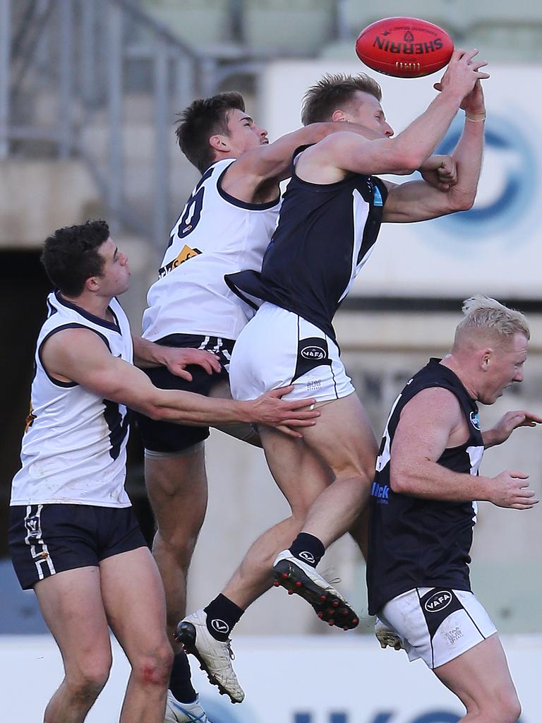 Vic Country’s Nathan Cooper and VAFA’s Tim Harper at Ikon Park, Carlton. Picture: Yuri Kouzmin