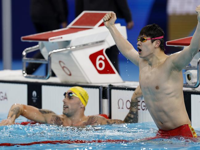 NCA. PARIS FRANCE. 2024 OLYMPIC GAMES. July 31 - Day 5 .  Swimming finals at the Paris La Defense Arena.    Mens 100 mtr freestyle final.        Chinas Zhanle Pan celebrates in front of 2nd placed Australian  Kyle Chalmers        . Pic: Michael Klein