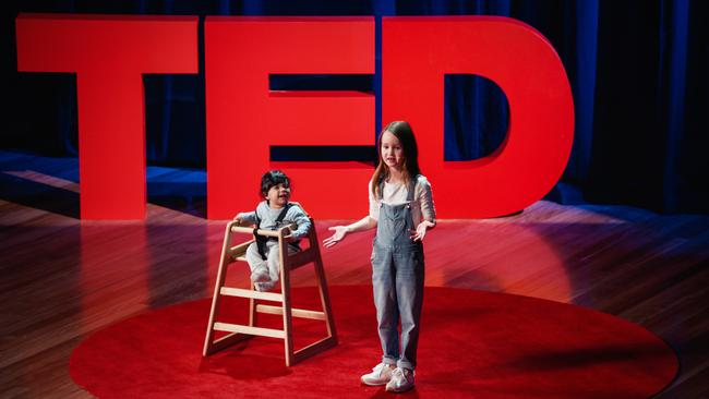 Molly Wright delivers her TED Talk with her neighbour, baby Ari Brar. Photo courtesy of TED.