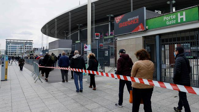 People arrive to be vaccinated against COVID-19 at a vaccination centre set up at the Stade de France in Saint-Denis, outside Paris. Picture: AFP