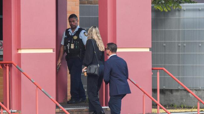 Alessandro Trombin (right) is let into Lismore Courthouse ahead of the not guilty verdict.