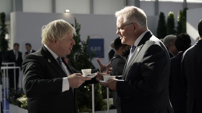 Prime Minister Scott Morrison chats to UK Prime Minister Boris Johnson at the G20 welcome event in Rome on Saturday. Picture: Adam Taylor