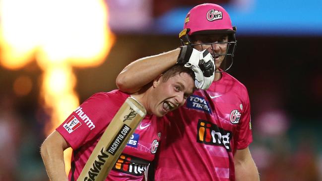 Hayden Kerr of the Sixers celebrates with Jay Lenton during the Big Bash League.