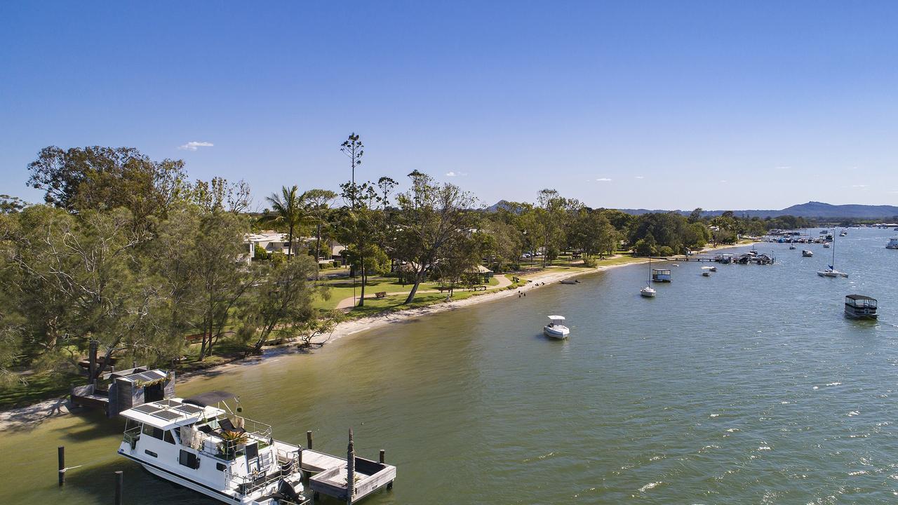 The new owners of this Noosa River jetty and houseboat will enjoy waking up on the waterfront to the remarkable sunrises. Picture: Jason Smith Photography.