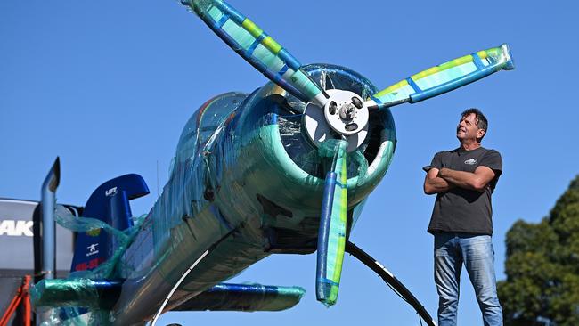 Aerobatic pilot and mechanic Hayden Pullen with one half of the extraordinary Yak 110 at Archerfield Airport. Picture: Lyndon Mechielsen