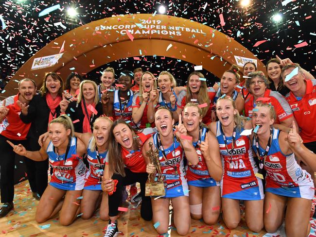 Swifts players celebrate winning the Super Netball Grand Final match between the Sunshine Coast Lightning and the New South Wales Swifts at the Brisbane Entertainment Centre in Brisbane, Sunday, September 15, 2019. (AAP Image/Darren England) NO ARCHIVING, EDITORIAL USE ONLY