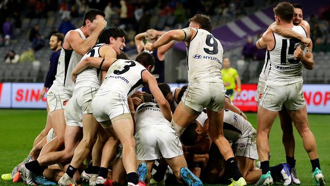 The Blues celebrate after Jack Newnes scores a goal after the siren to win the match .