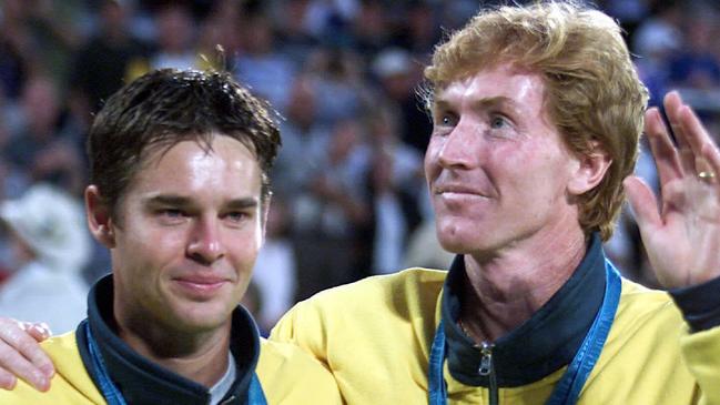 Aust tennis player Mark Woodforde with Todd Woodbridge after receiving silver medals at presentation for mens doubles during Sydney Olympic Games 27 Sep 2000. medal