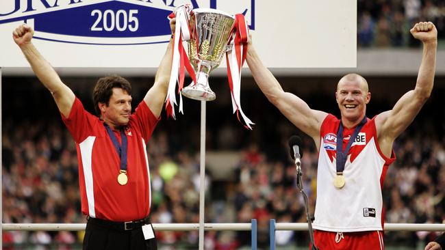 Sydney coach Paul Roos and Barry Hall raise the cup in 2005.