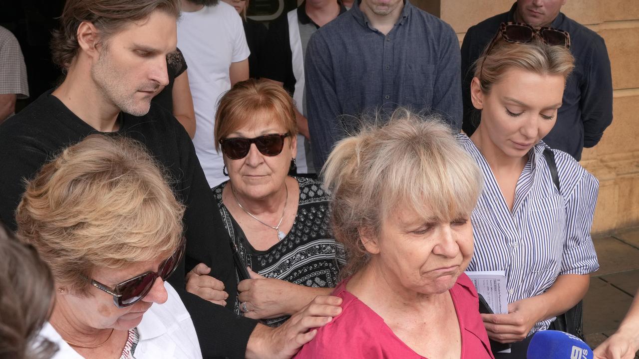 Family of Mr Sweetman gather outside court on Tuesday. Picture: Dean Martin