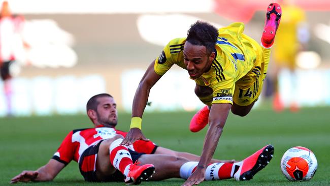 Southampton defender Jack Stephens brings down Arsenal striker Pierre-Emerick Aubameyang. Picture: AFP