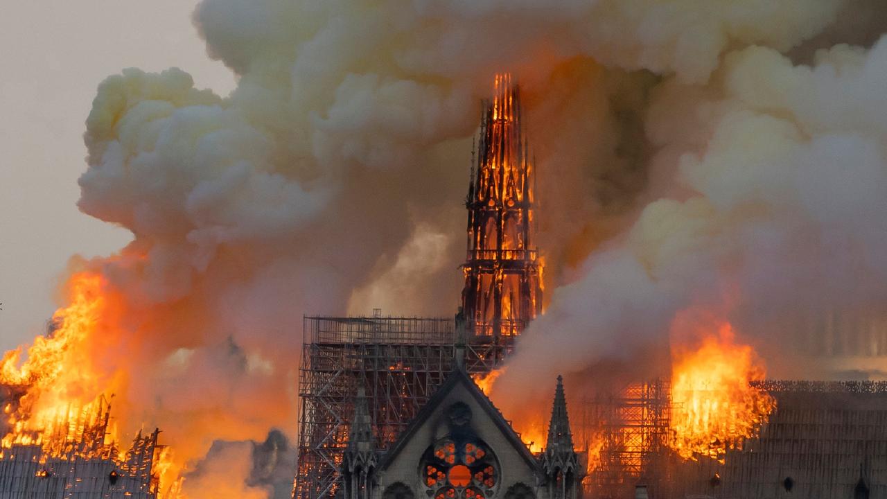 flames burn through the roof of the Notre-Dame, authorities say the fire was accidental. Picture: AFP 