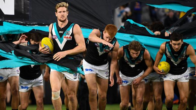 Tom Jonas leads the Power out against West Coast. He has sat out the past two games with a calf injury. Picture: Daniel Carson/AFL Media/Getty Images