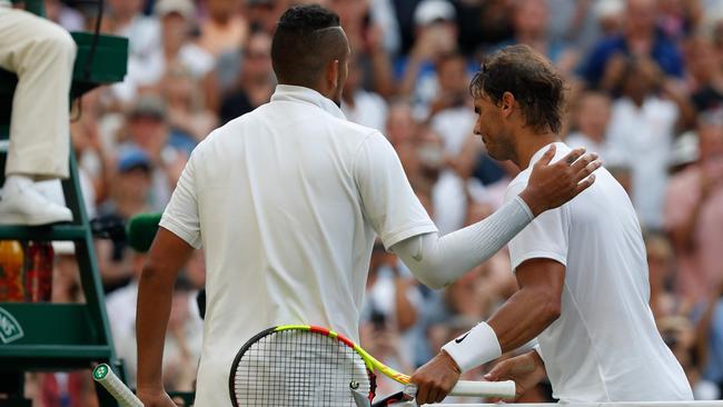 Rafael Nadal gets a pat on the back from Nick Kyrgios following their Wimbledon epic. Picture: AFP