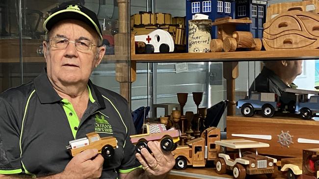 Cairns Men’s Shed President Bob Lavington shows some of the beautifully crafted timber toys which will be available at their Christmas sale on December 11, 2021 at 186 Irene St, Mooroobool.