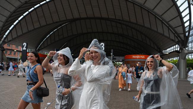 Despite heavy rainfall, Swifties have flocked to Accor Stadium to watch Taylor Swift perform live. Picture: NCA NewsWire / Flavio Brancaleone